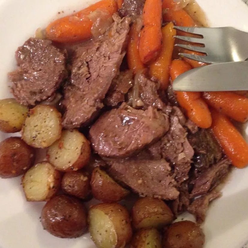 Pot Roast - Slow cooking with carrots and potatoes