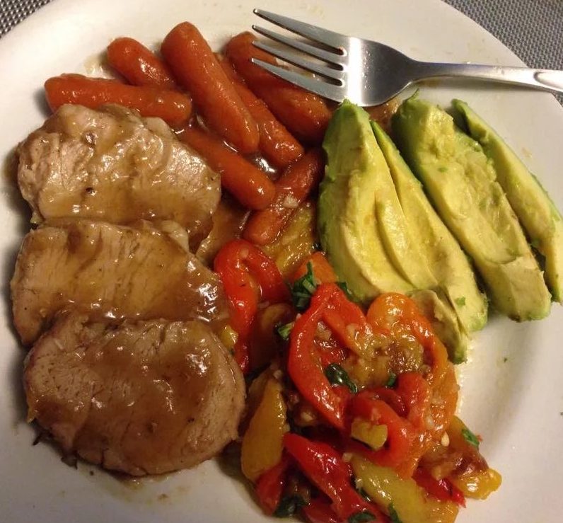 Slow Cooke Pork Tenderloin with baby carrots, roasted red peppers, onions and avocado