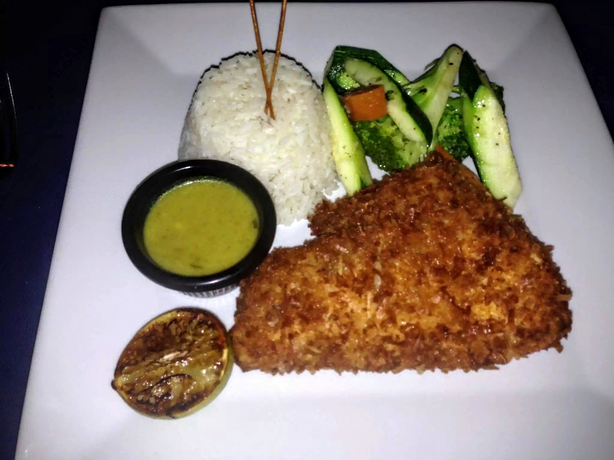 Coconut Crusted Grouper - Caicos Grouper House Dipped Coconut, Basmati Rice, Sauteed Seasonal Vegetables, Homemade Coconut Nectar