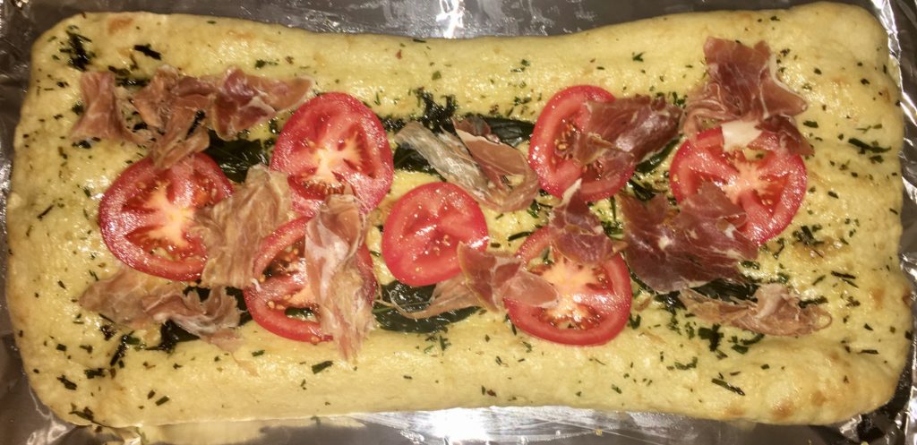Fokachio Flat Bread Pizza with tomato, basil, garlic, prosciutto and olive oil