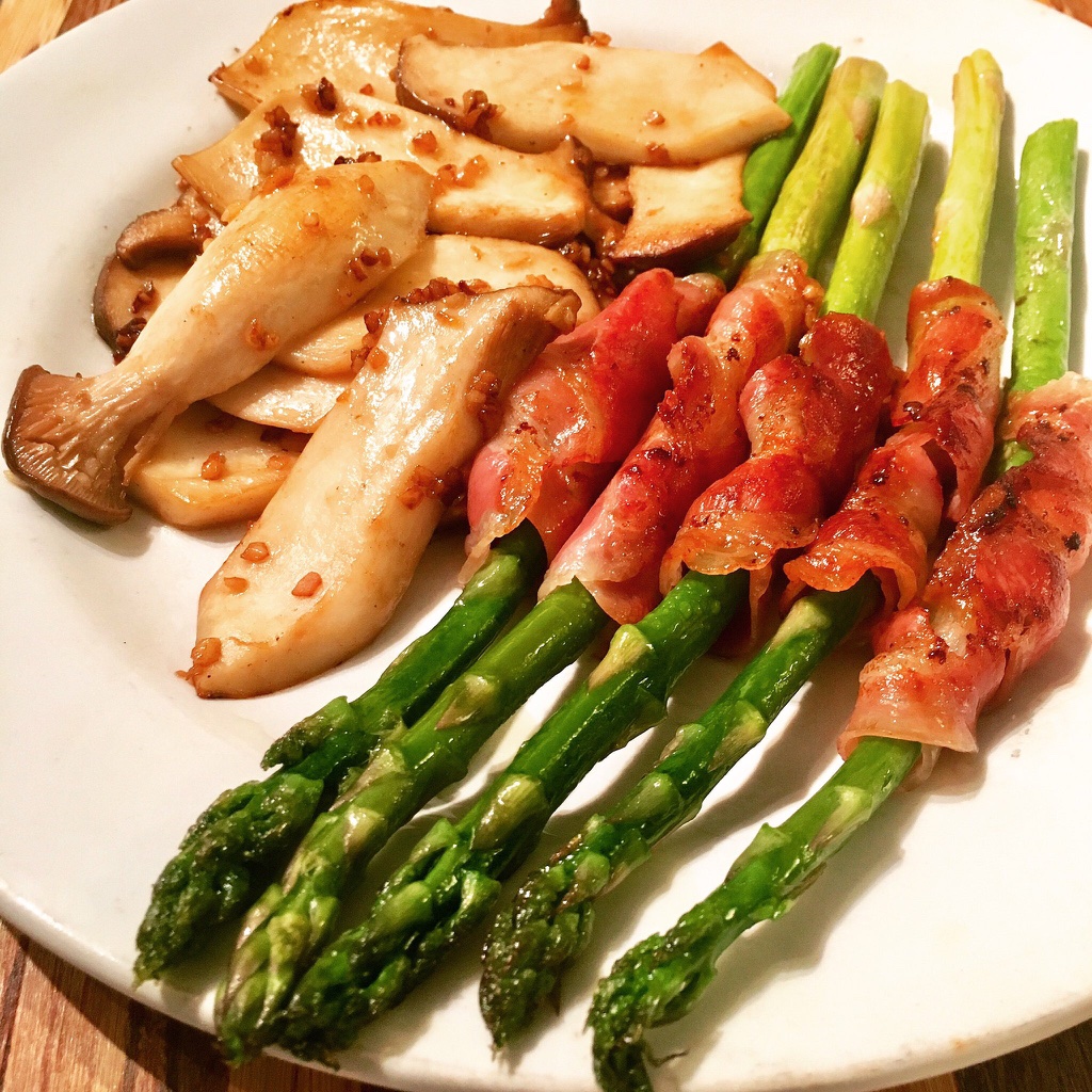 Pancetta wrapped asparagus with garlic butter King Oyster mushrooms